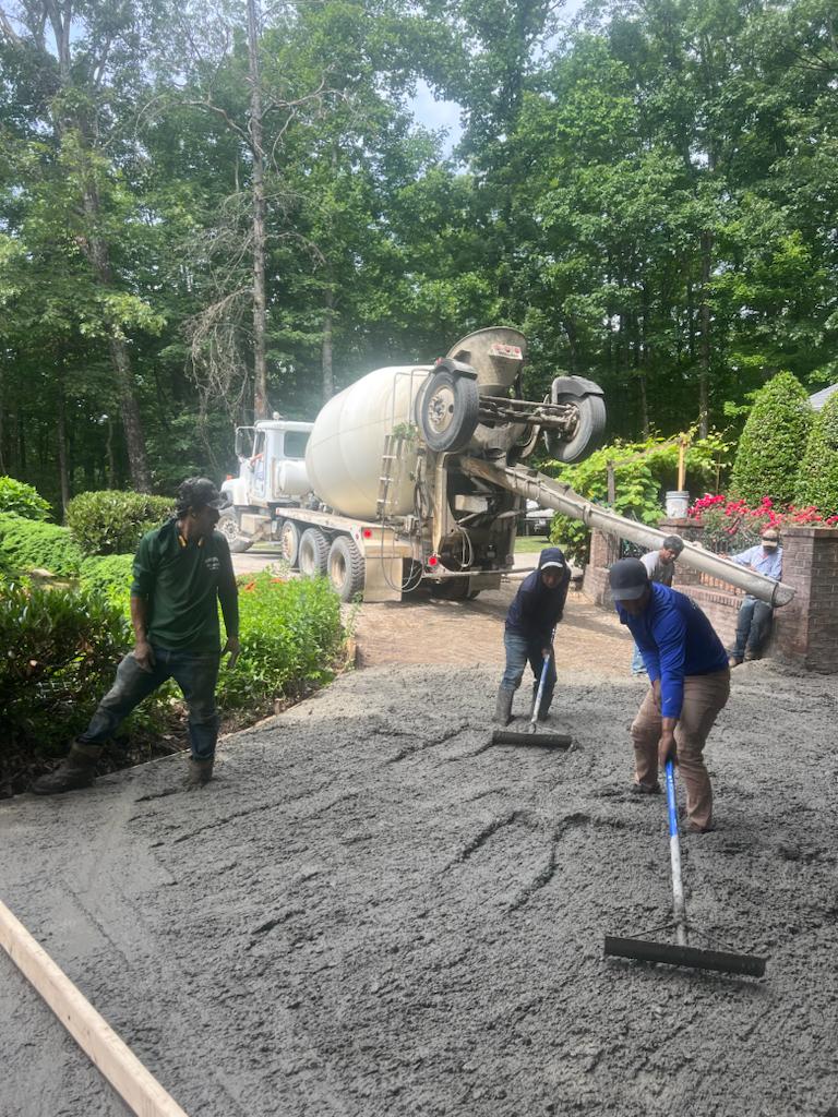 Ramirez Lawn & Landscaping crew completing a landscape installation in Hendersonville, NC.